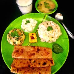 A picture of Vrat Farali Thali: Potato Peanut Kadhi, Barnyard Khichdi, Rajgira Potato Paratha, Potato Sabzi.