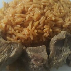 A picture of Jollof rice with beef.