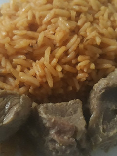 A picture of Jollof rice with beef.