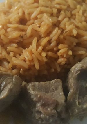 A picture of Jollof rice with beef.