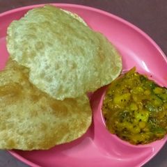 A picture of Poori with Potato Masala.