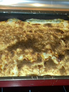 Una foto de Lasaña gratinada