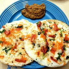 A picture of Mixed Veg Uthappam with Kara Chutney.