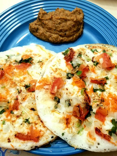 A picture of Mixed Veg Uthappam with Kara Chutney.