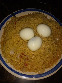 A picture of Indomie with boiled eggs.
