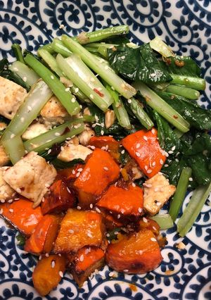 A picture of Miso roasted squash with ginger garlic tofu and greens - vegan.