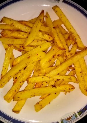 A picture of French fries in air fryer.