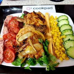 A picture of My Peri Peri Pork Chops and Pepper flakes with onions & Salad 😍.