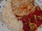 Una foto de corvina en salsa