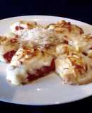 Pimientos de piquillo rellenos de setas y gratinado de piñones