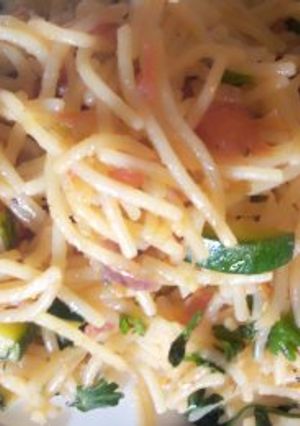 A picture of Stir fried spaghetti with cheese.