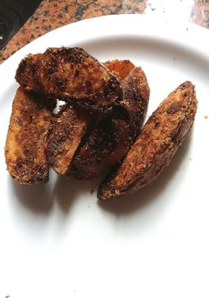 Una foto de Papas rústicas.. Con el secreto para que no se peguen al hornear