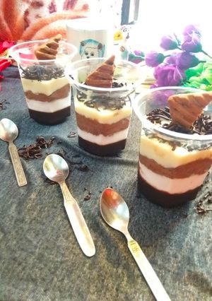 A picture of Four layered chocolate mousse.