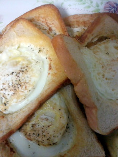 A picture of eggs in a hole.