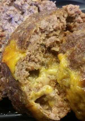 A picture of Spicy Cheddar Stuffed Mini Meatloafs.