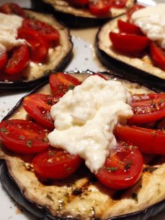 A picture of Eggplant Bruschetta with Burrata and Cherry Tomatoes.