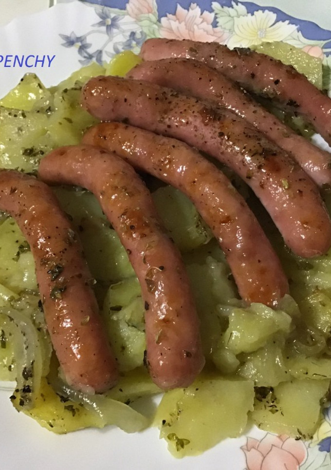 Una foto de Asado oreganado con salchichas al brandy