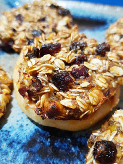 A picture of Baked oats medallions over nut apple donuts.
