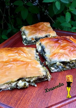A picture of My Mom’s Spanakotyropita (Spinach and Feta Pie) ❤️.