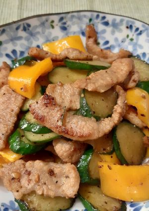 A picture of Cucumber, yellow pepper and pork stir fry.
