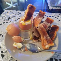 A picture of My Crispy Soldiers and soft boiled egg.
