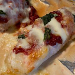 A picture of Chicken Pizza Melts with Salad and Garlic Bread.