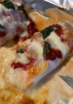 A picture of Chicken Pizza Melts with Salad and Garlic Bread.