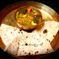 A picture of Chana daal with leftover vegetables.