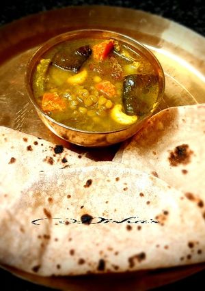 A picture of Chana daal with leftover vegetables.