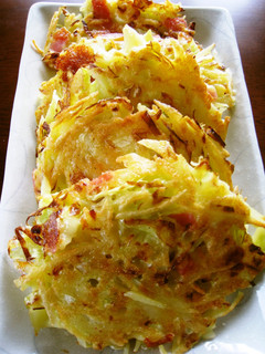 A picture of Cheesy Baked Potatoes and Cabbage.