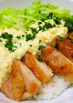 A picture of Teriyaki Chicken Rice Bowl with Plenty of Tartar Sauce.
