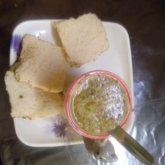 A picture of Chicken soup with bread toast.