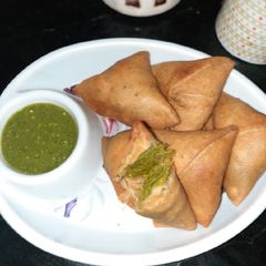 A picture of Whole wheat flour samosa with green peas stuffing.