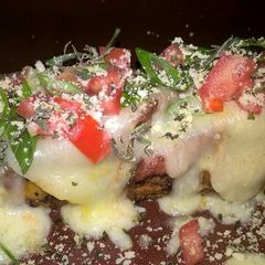 A picture of Tevaughn's non traditional Canoa de Platano stuffed with teriyaki chicken and mozzarella (ripe plantain canoe).