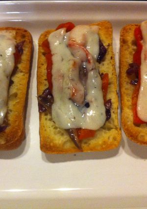 A picture of Roasted Red Pepper, Anchovy, and Manchego Cheese Toasts.
