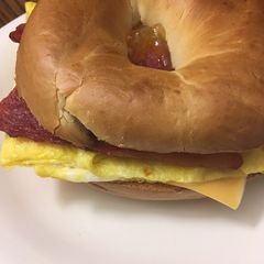 A picture of Bacon egg and cheese bagel (or vegetarian).