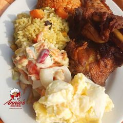 A picture of Fried rice,Jollof rice,Fried chicken, Potatoe Salad and coleslaw.