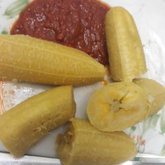 A picture of Boiled plantain with pepper sauce.