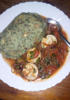 A picture of Mukimo with egg curry.