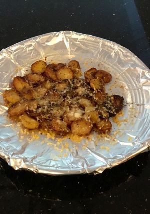 A picture of Crispy Cheese Topped Baby Potatoes.
