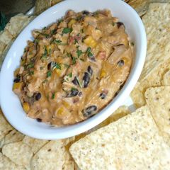 A picture of Cheesy Black Bean & Corn Buffalo Chicken Dip.