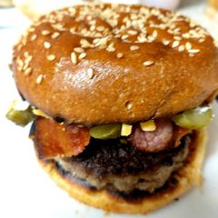 A picture of My Beef, Bacon Onion Rings and two Cheese + Gherkin Burger. 😘.