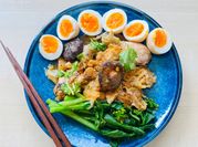 A picture of rice and stew with boiled eggs