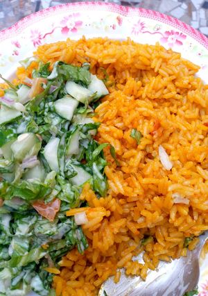 A picture of Concoction rice with salad.