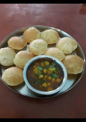 A picture of Bela kachori with aloo chole ki sabzi.