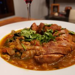 A picture of Merguez Sausage and Cumin Lentils with Dandelion Greens.