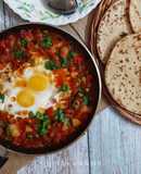 Shakshuka (In my style- Poached eggs in tomato and veggie gravy)