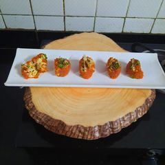 A picture of Gajar ka halwa sushi roll with rabri cream cheese filling.