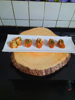 A picture of Gajar ka halwa sushi roll with rabri cream cheese filling.