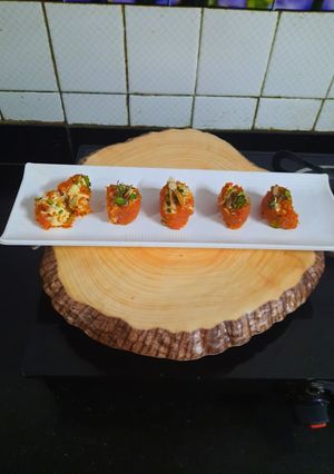 A picture of Gajar ka halwa sushi roll with rabri cream cheese filling.